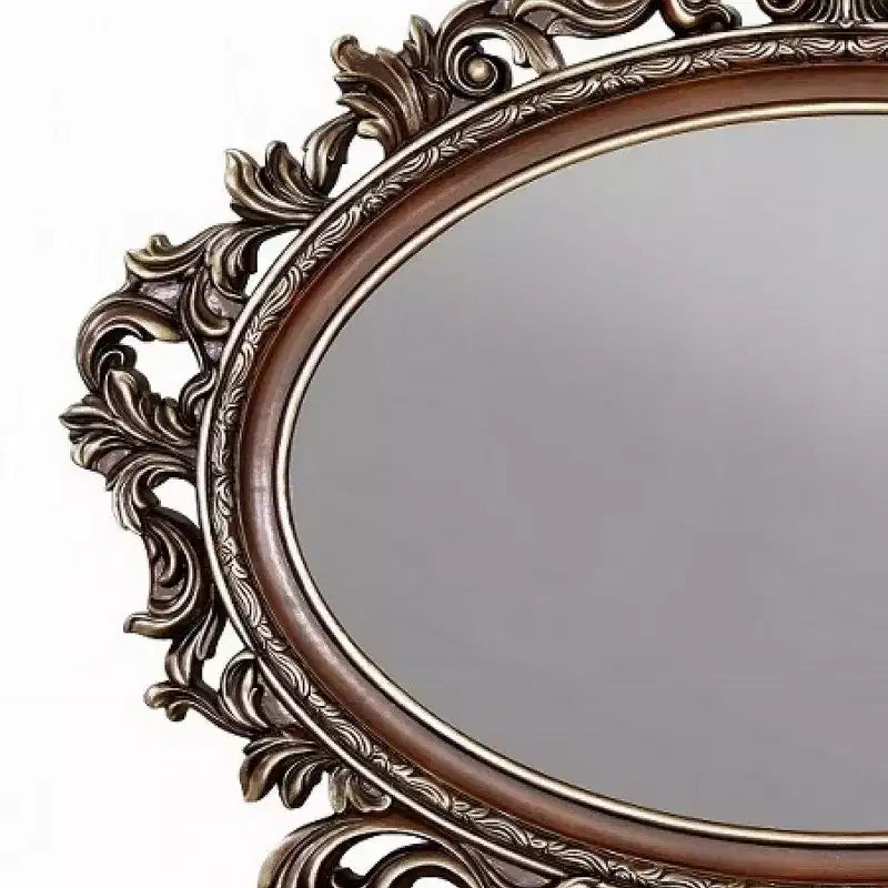Specchiera ovale con accenti, cornice in ciliegio e scrollwork in champagne spazzolato, 43x53